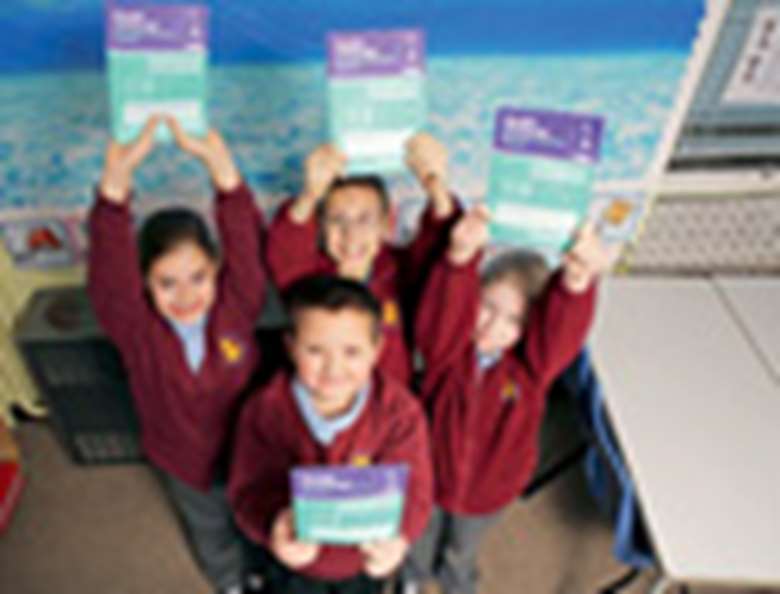 Children hold Healthy Schools literature