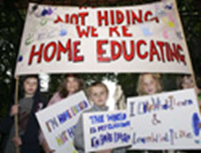 Children with pro-home education banners. Credit: Phil Adams