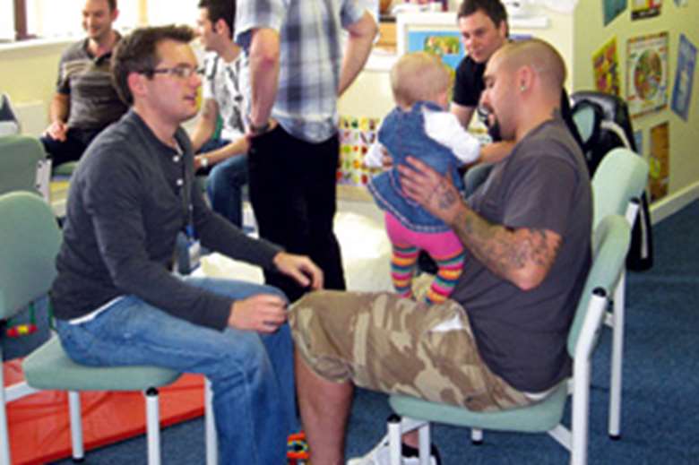 Expectant fathers get first-hand knowledge from "veteran" dads at the sessions