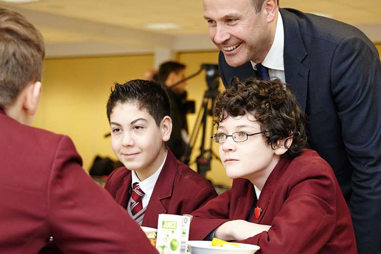 Children's Society chief executive Matthew Reed joins children having lunch at the report launch. Image: Brayton Gillette/The Children's Society