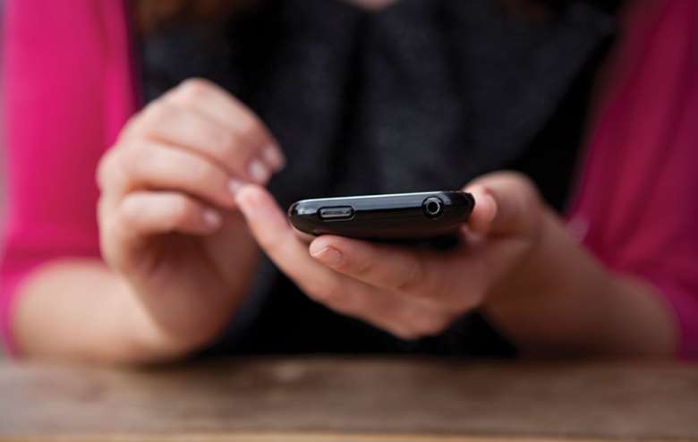 Bullying now occurs on phones. Picture: Alamy
