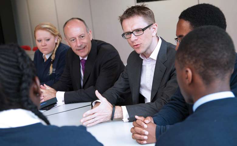 Jules Pipe, mayor of Hackney, and Anthony Impey, chief executive of Optimity, with pupils from Urswick Secondary School