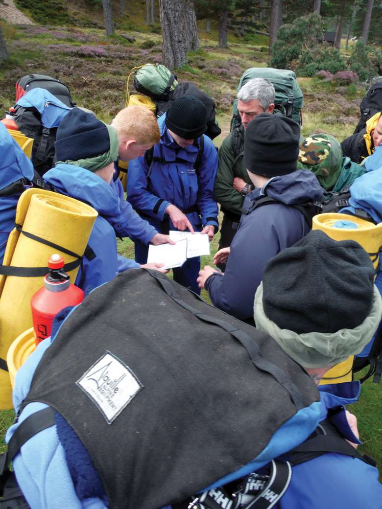 Young people get together to plan their journeys in the wild, incorporating activities such as abseiling, climbing and canoeing 