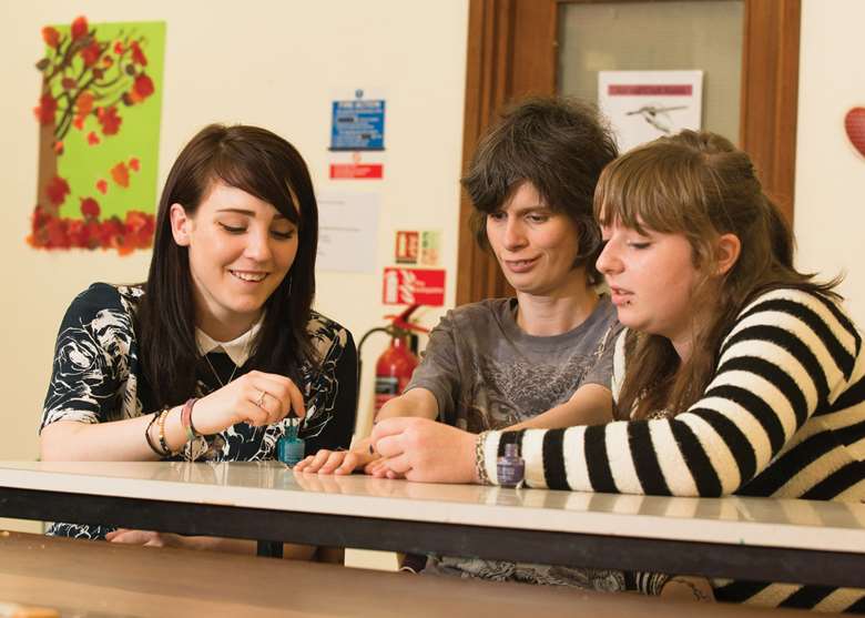 Bex Taylor (left) and other young people on the trainee programme work at the council’s Stevenage Resource Centre. Picture: Leo Cinicolo