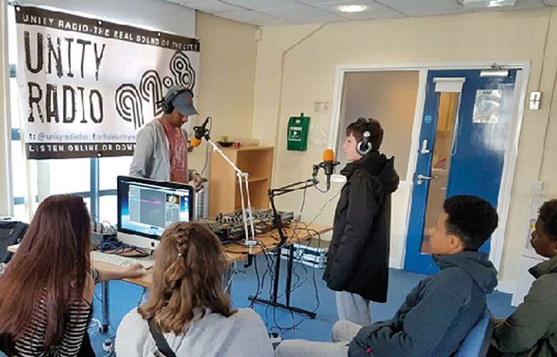 Young people work on their radio show