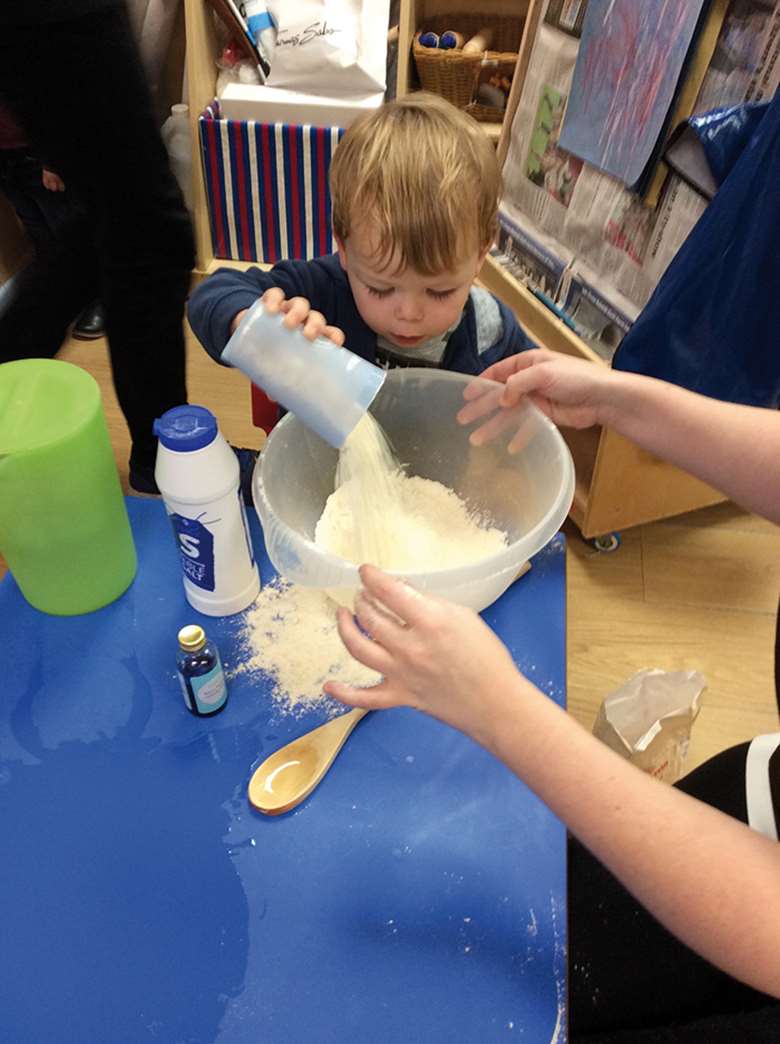 Children at Portico Poppets nursery learn about weighing and measuring using cups