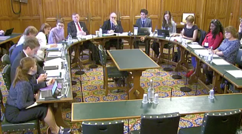 Young people with experience of care sat alongside members of the education select committee at a hearing on fostering. Picture: UK Parliament