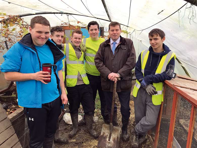 Cumbria PCC Peter McCall and young people at a local community garden project