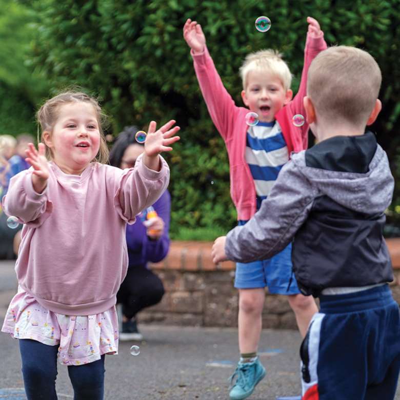 Chasing bubbles is one way Healthy Movers sessions help children to learn about the importance of being physically active