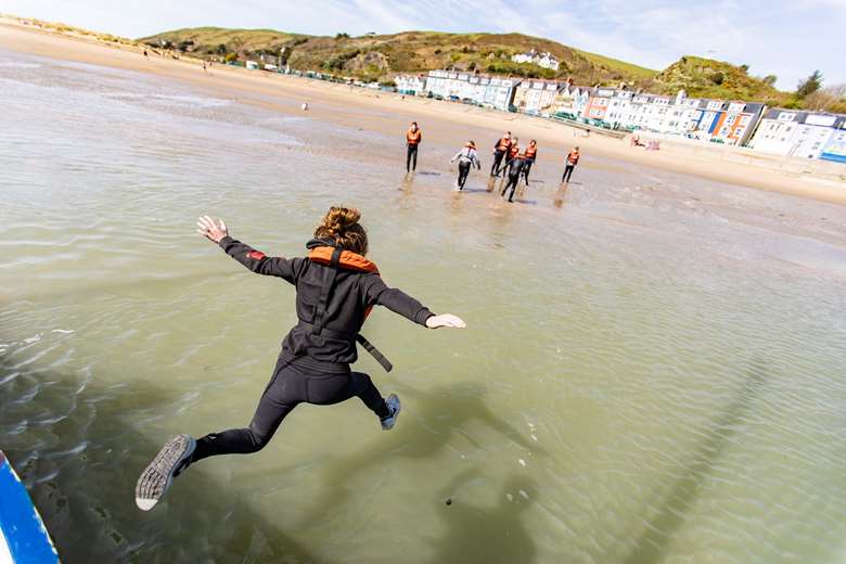 Young people take the plunge at Outward Bound Trust's activity centre in Aberdovey, Snowdonia. Picture: Outward Bound Trustt