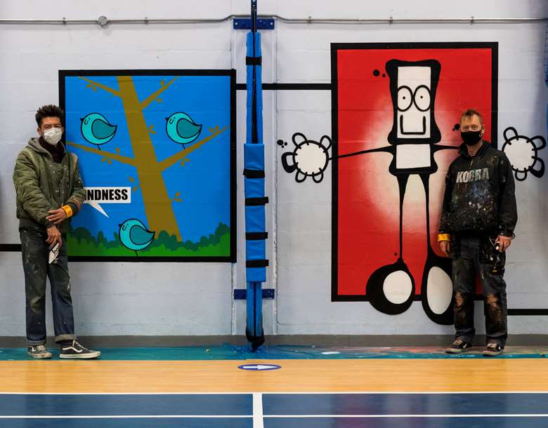 Artists Fark and My Dog Sighs with the mural in Portsmouth. Picture: Portsmouth City Council