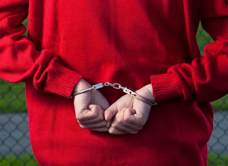 MPs have called for an end to handcuffing children in care. Picture: Adobe Stock