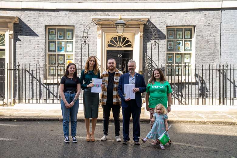 Campaigners deliver the letter to Downing Street. Picture: NSPCC