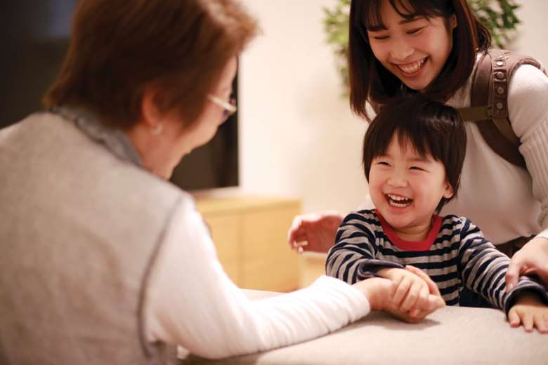 Children regularly play and mingle with the elderly residents at Kotoen in Tokyo. Picture: Yamasan/Adobe Stock