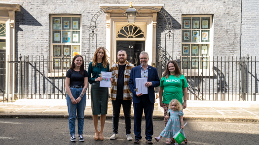 Campaigners deliver the letter to Downing Street. Picture: NSPCC