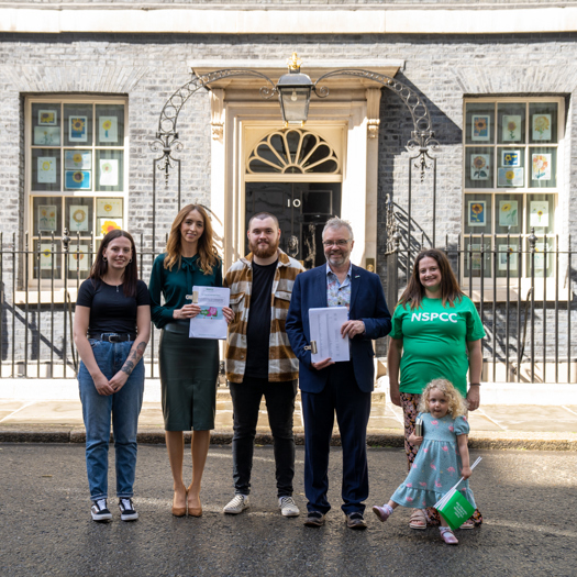 Campaigners deliver the letter to Downing Street. Picture: NSPCC