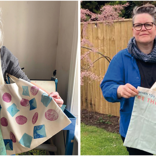 Michelle Wood and Nicola Golightly with two of the bags created by young people printed by charity Blue Cabin