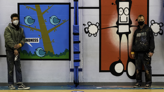 Artists Fark and My Dog Sighs with the mural in Portsmouth. Picture: Portsmouth City Council