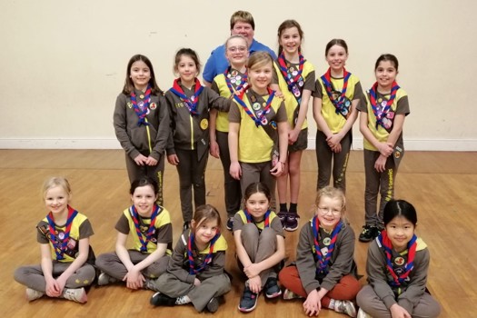Yaroslava, eight, (pictured centre), with her friends at 5th Winchester City Brownies. Picture: Girlguiding