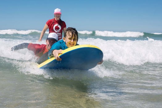 Young people report improvements in confidence, feeling ‘calmer’ and ‘more positive’ about life after taking part in weekly surf lessons with the Wave Project. Picture: Bella Rose Bunce